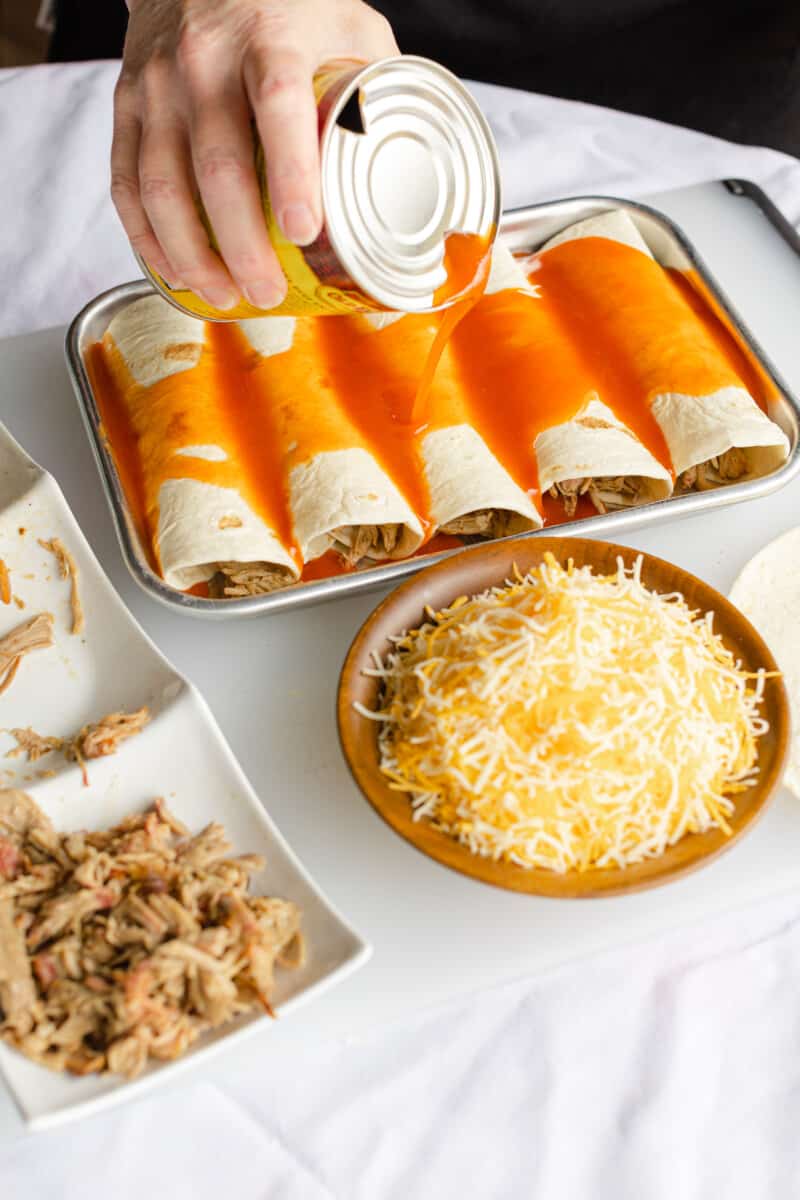 Cover the Wrapped Tortillas with Red Enchilada Sauce.