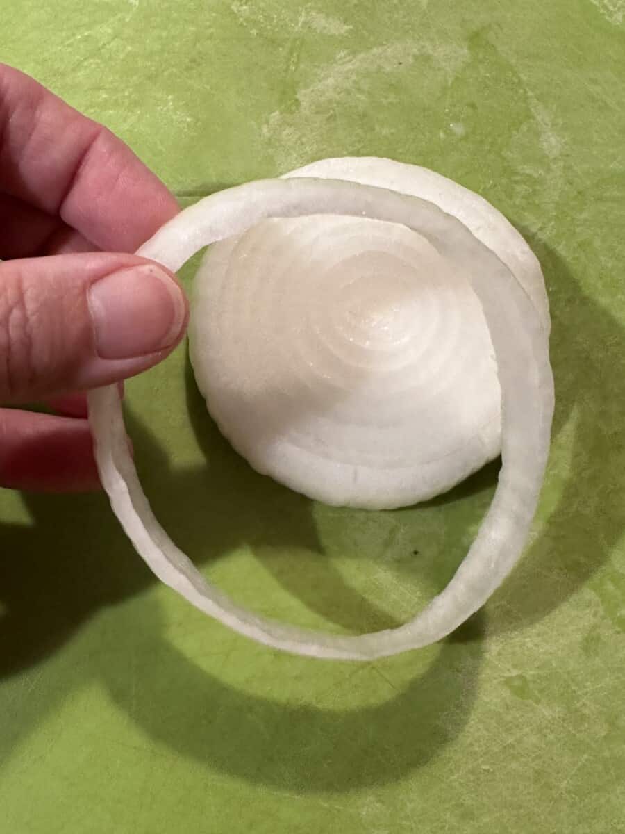 Remove the Outside Ring of the Slice of Onion.