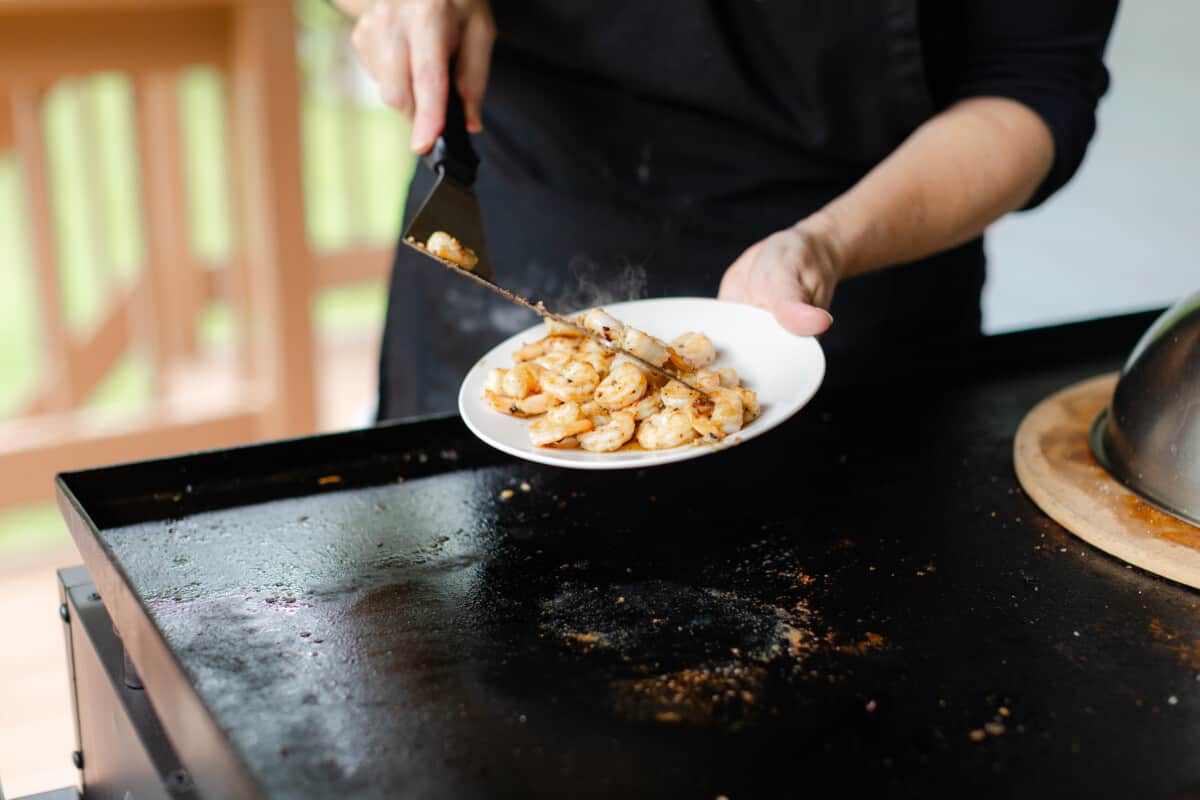 Removing the Griddle Shrimp and Placing on a Serving Plate