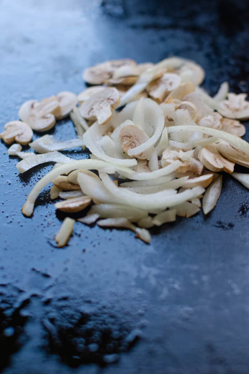 Griddle Sautéing Mushroom and Onions