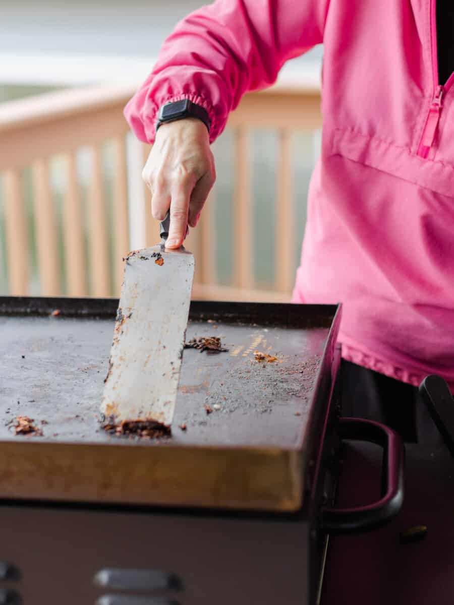 Use Lots of Elbow Grease to Clean the Entire Surface by Scraping off the Debris.