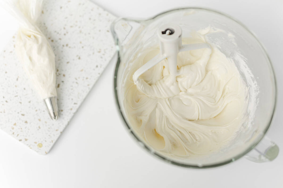 A Pipping Bag and a Mixing Bowl of Cream Cheese Frosting.
