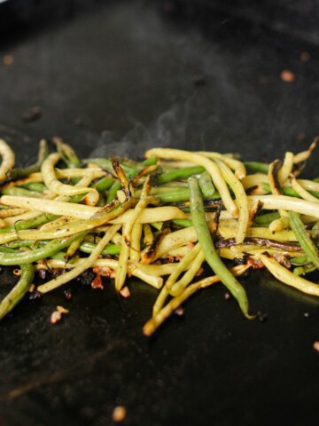 Blackstone Green Beans & Yellow Beans cooking on a hot flat top.
