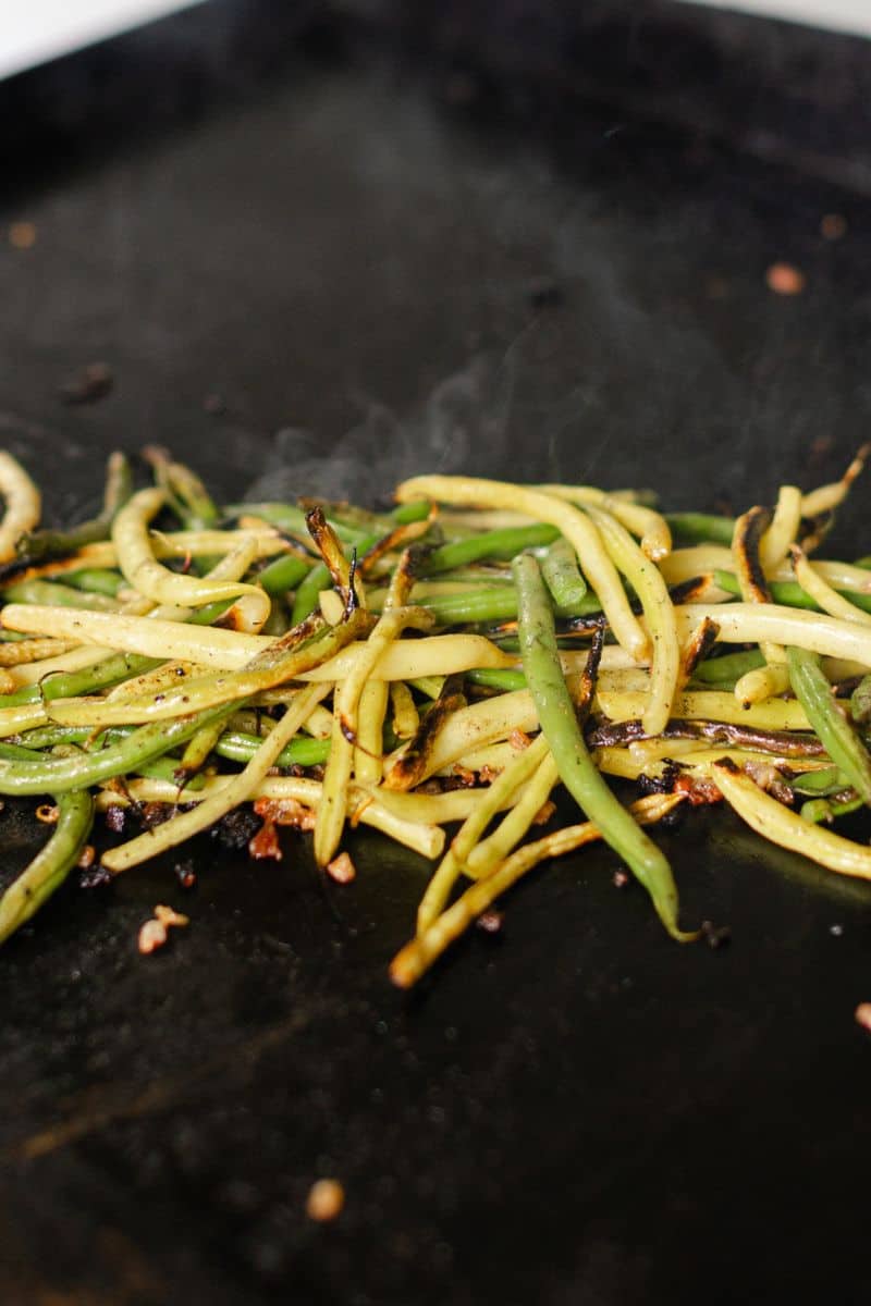 Blackstone Green Beans & Yellow Beans cooking on a hot flat top.
