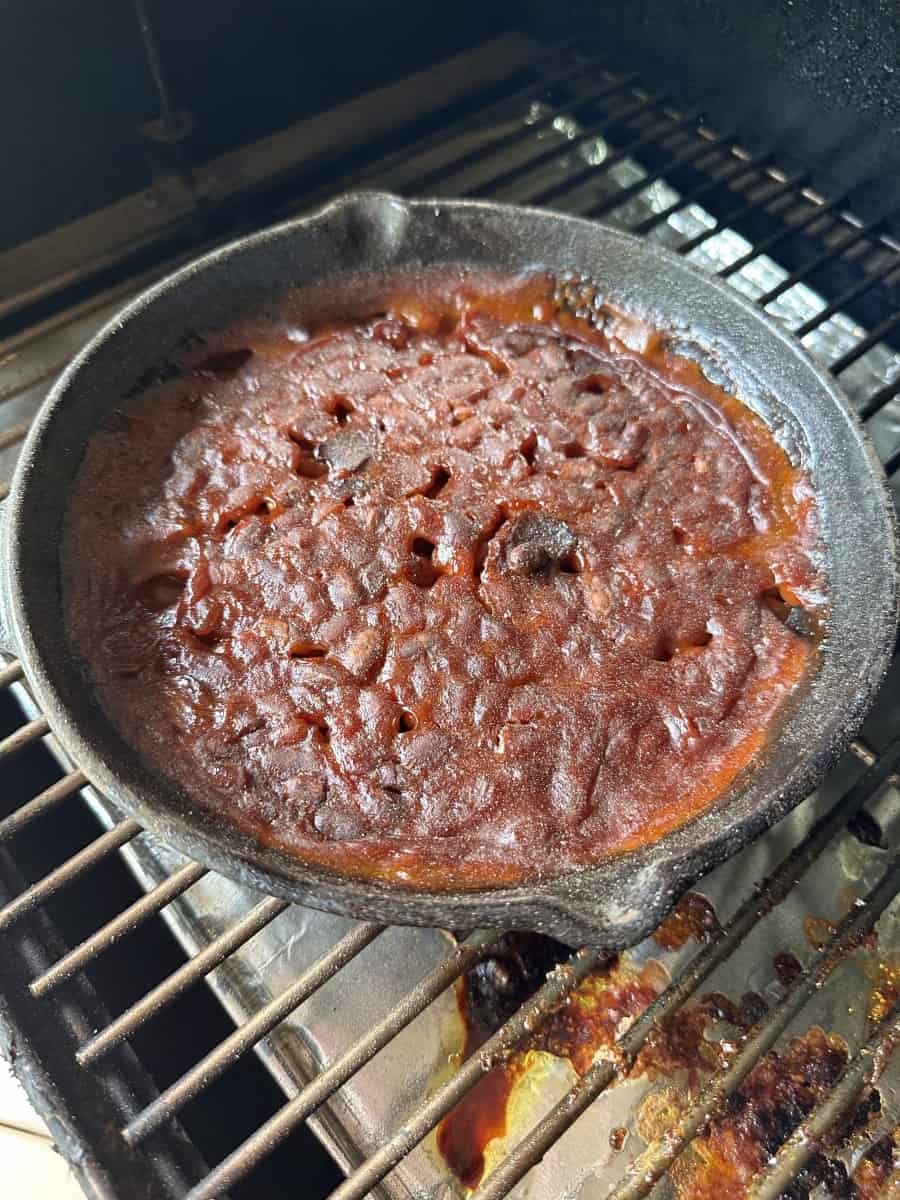 Fully Cooked Smoker Baked Bean in a Cast Iron Skillet