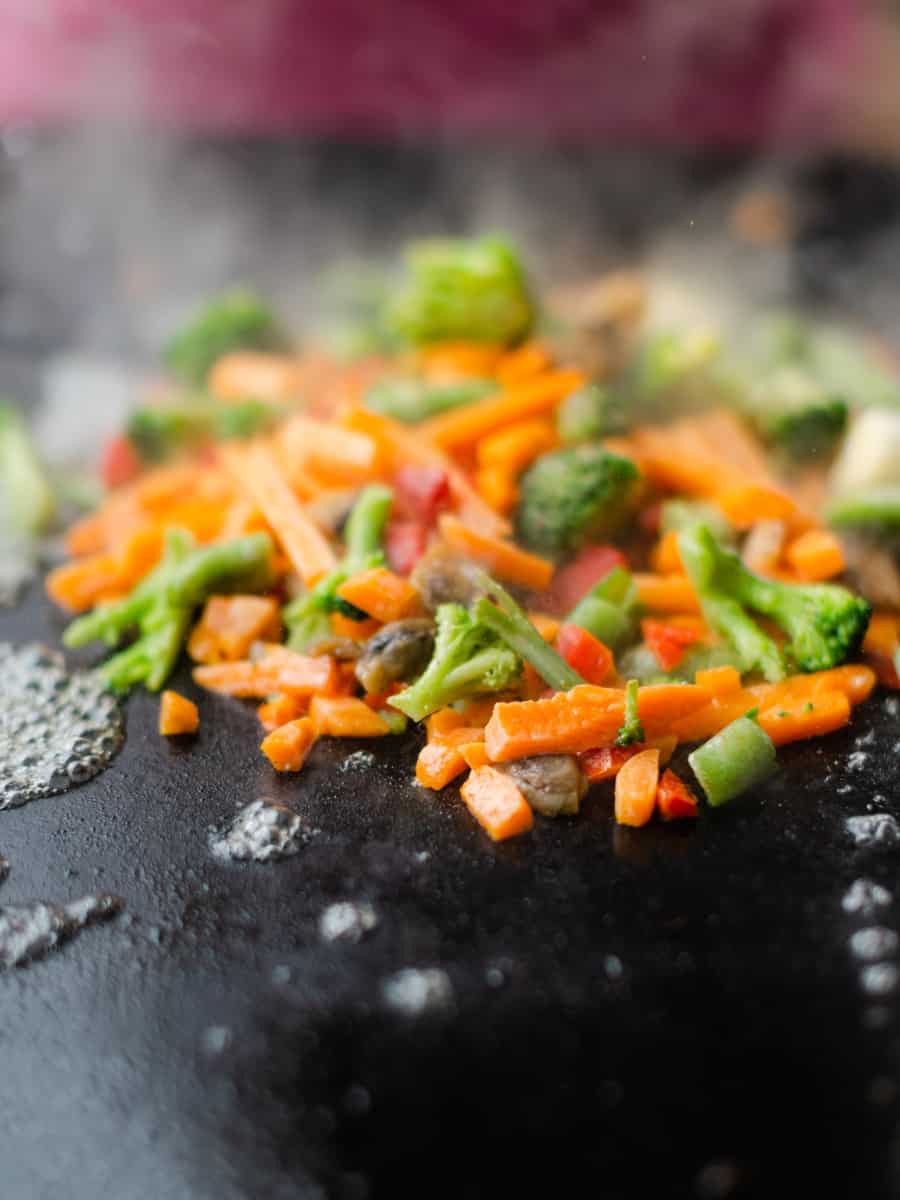 Cooking Vegetables on a Blackstone Griddle (Carrots, Broccoli, Snap Peas, Peppers, and Mushrooms).