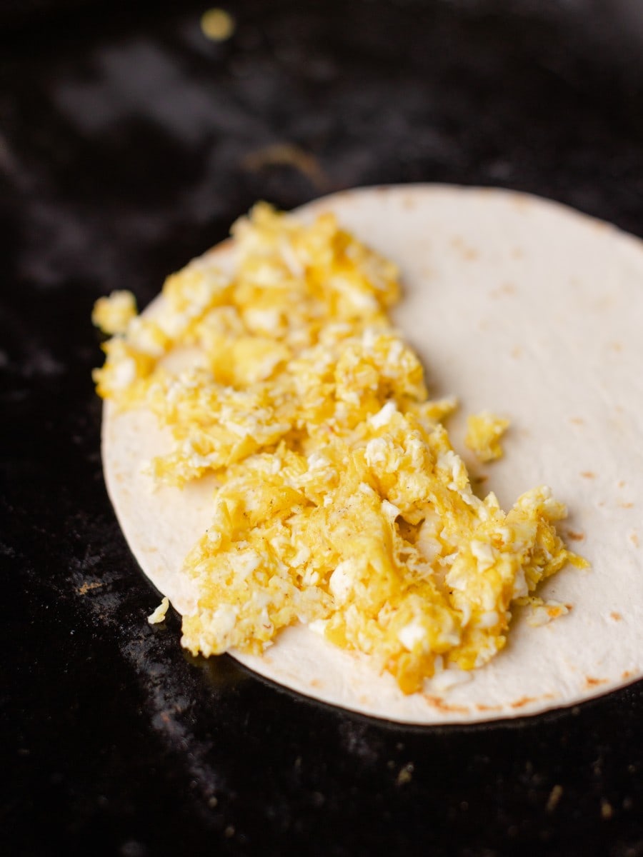 Add the Scrambled Eggs to Half of the Soft Tortilla Shell on the Griddle.