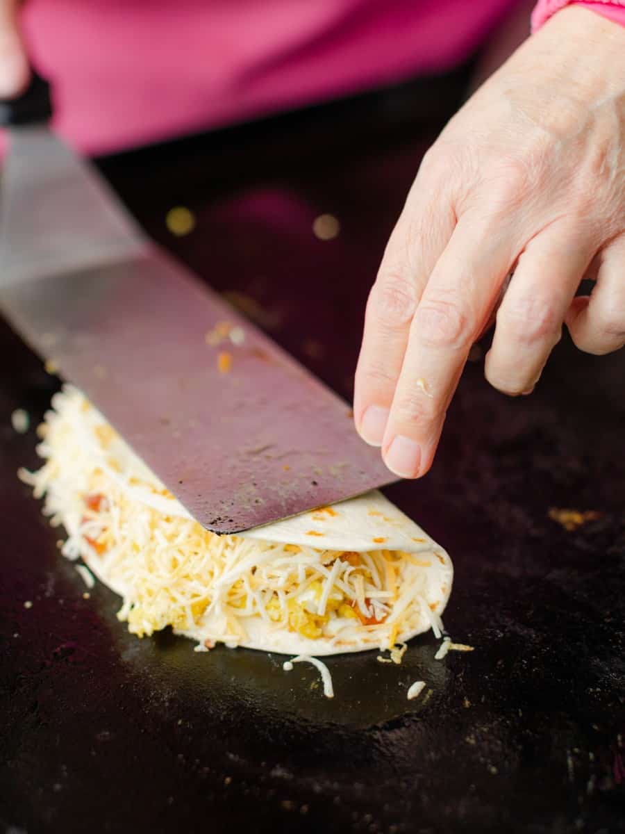 Fold the Tortilla Shell on top of the Shredded Cheese.