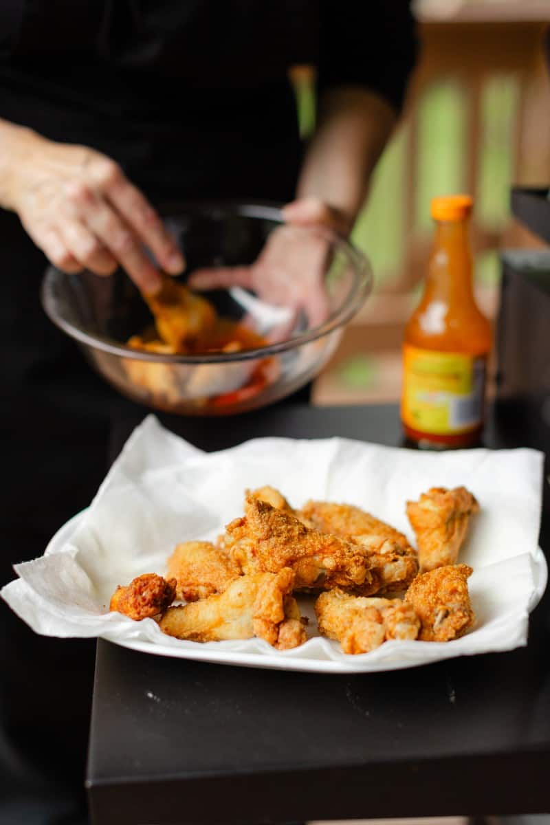 Place Deep Fried Wings on a Paper Towel Plate before tossing into buffalo sauce.