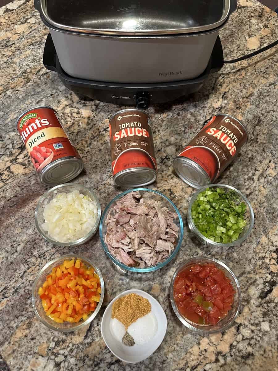 Pork Chili Ingredients - Diced Tomatoes, Tomato Sauce, Diced Onions, Celery, Peppers, Rotel, Shredded Pork, and seasonings