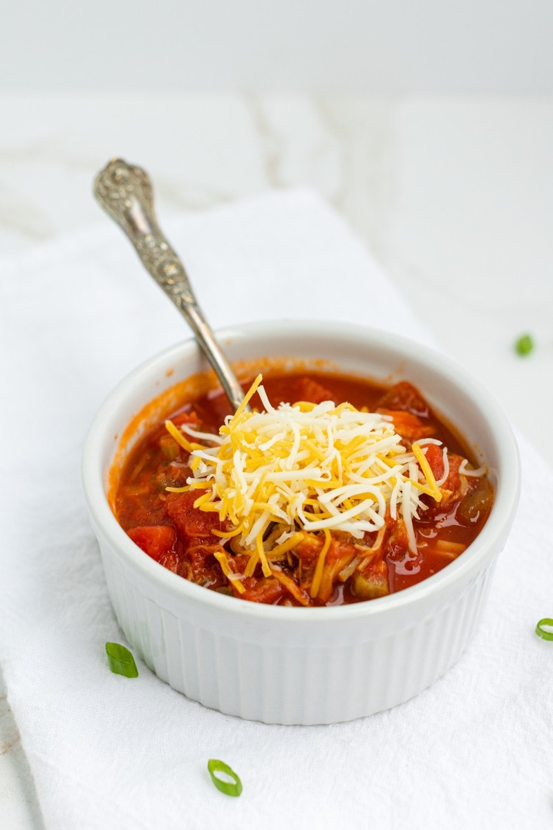 Pulled Pork Chili Recipe topped with Shredded Cheese