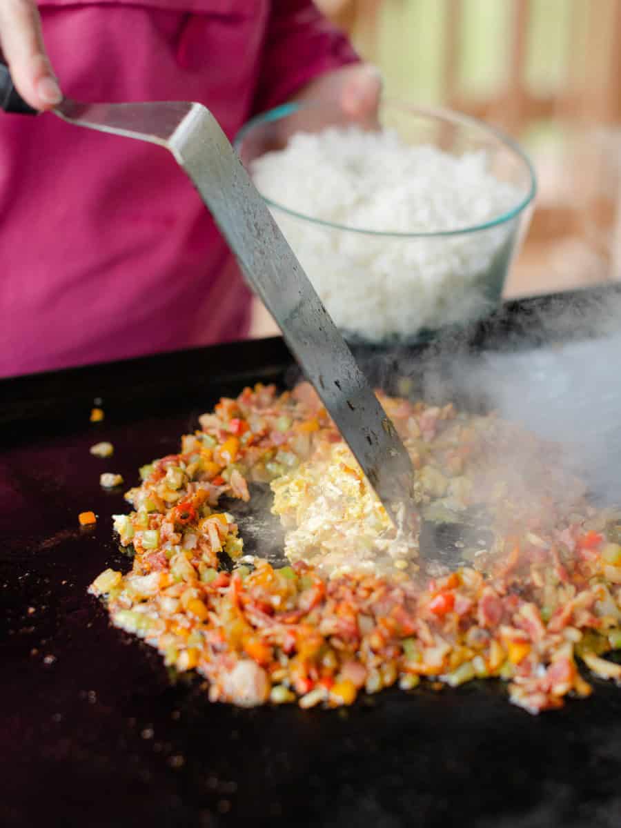 Use the Tip of the Griddle Spatula to Scramble Eggs of Fried Rice.