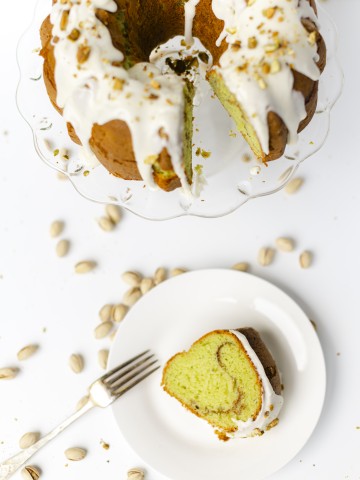 Pistachio Bundt Cake with a slice of cake on the side.