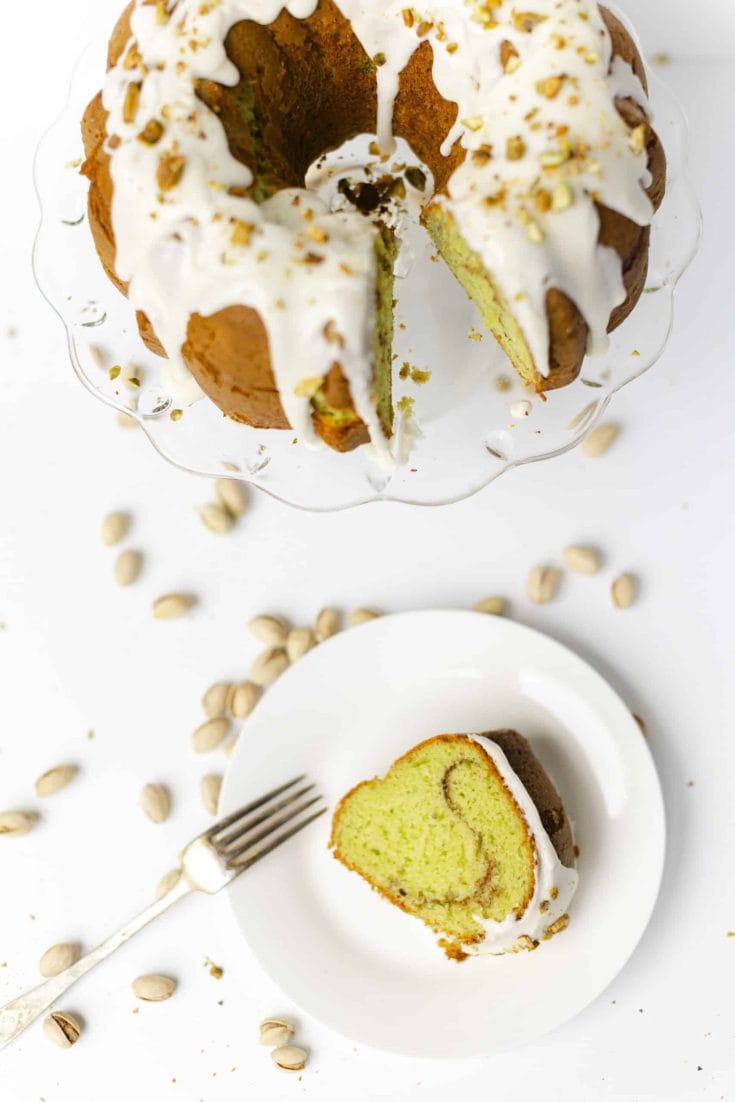 Pistachio Bundt Cake with a slice of cake on the side.
