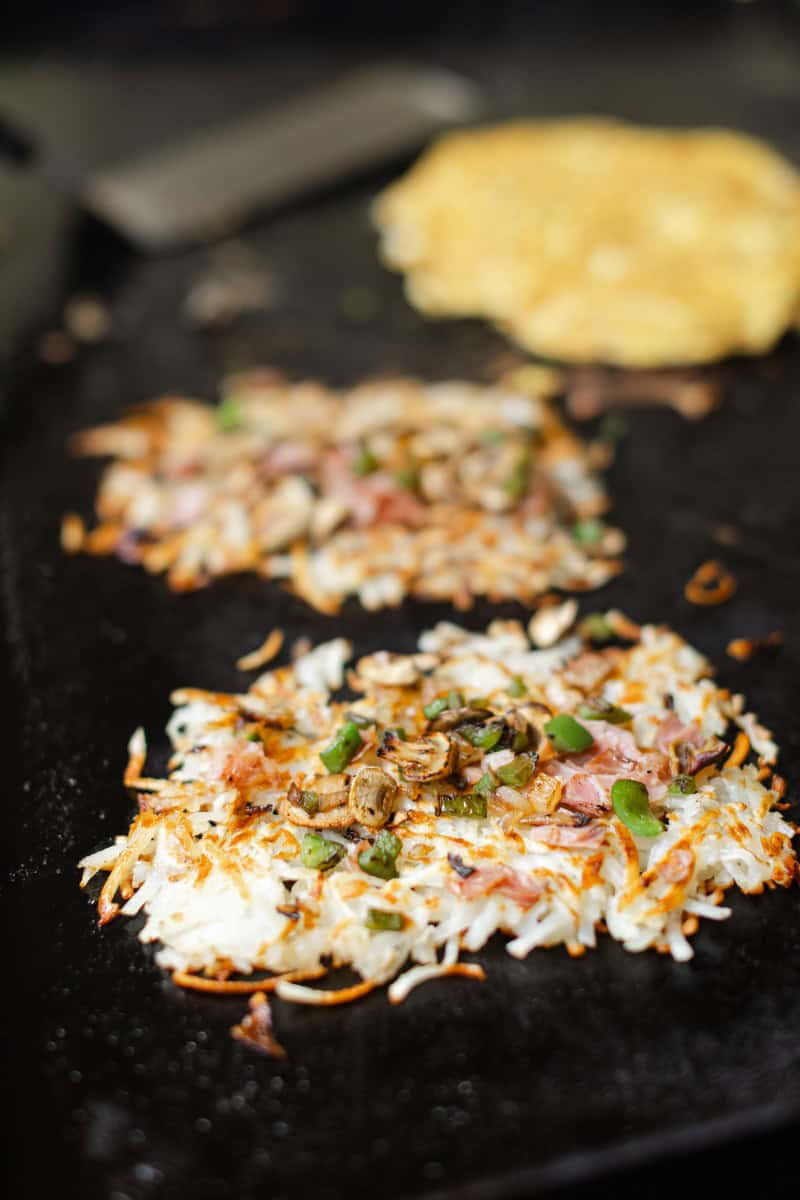 Topping Hash Browns with the Sautéed Vegetables