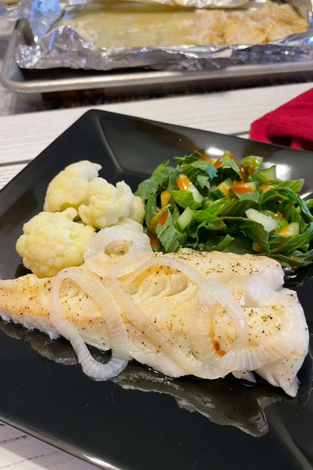Baked Walleye Pinterest with a side of cauliflower and salad