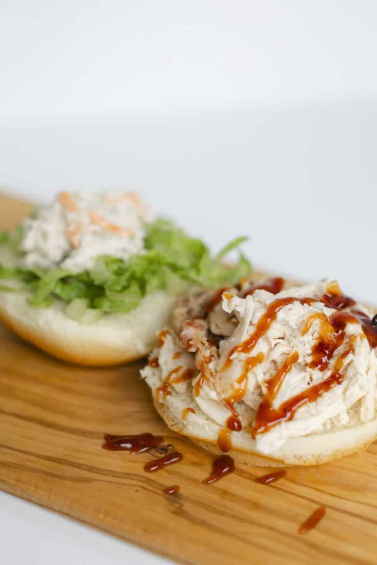 Sandwich made with Shredded Smoked Chicken, BBQ Sauce, Lettuce, Coleslaw, and a Hamburger Bun.