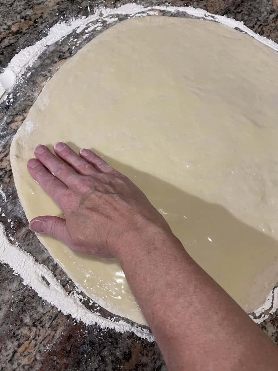 Spread the Melted Butter on the whole top of the rolled out dough.
