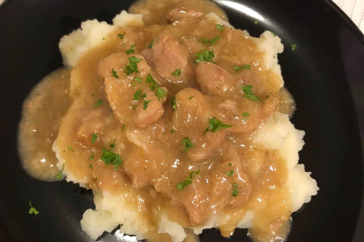 Pork and Gravy overtop homemade mashed potatoes