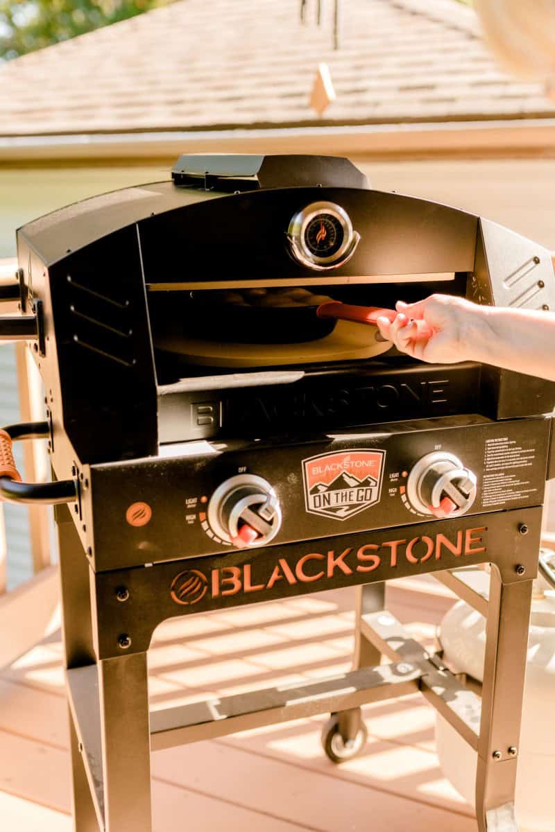 Placing a Cast Iron Pan into a Blackstone Pizza Oven