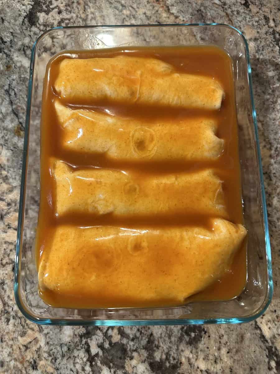 Enchilada Sauce over top Wrapped Shredded Chicken