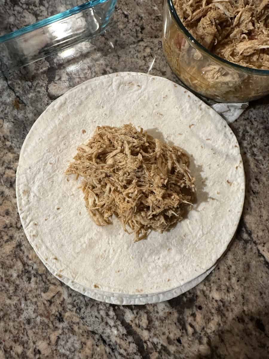 Shredded Chicken on top of Flour Tortilla Shells