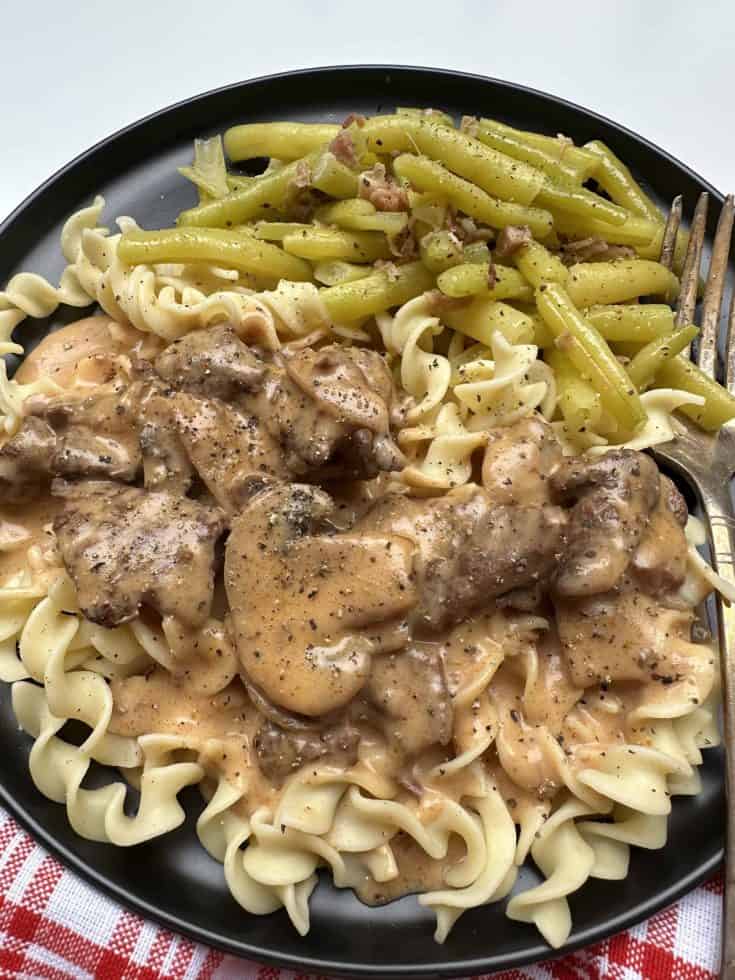 Elk Backstrap in a Creamy Mushroom Sauce with a side of boiled yellow beans.