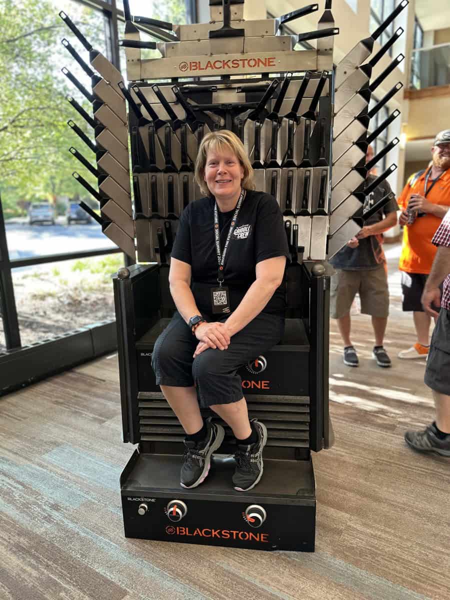 Chef Sherry Ronning sitting in the Blackstone Spatula Chair