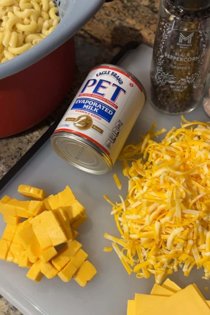 Air Fryer Mac and Cheese Ingredients: Evaporated Milk, Shredded and Cubed Cheese, Cooked Elbow Macaroni, Salt and Pepper