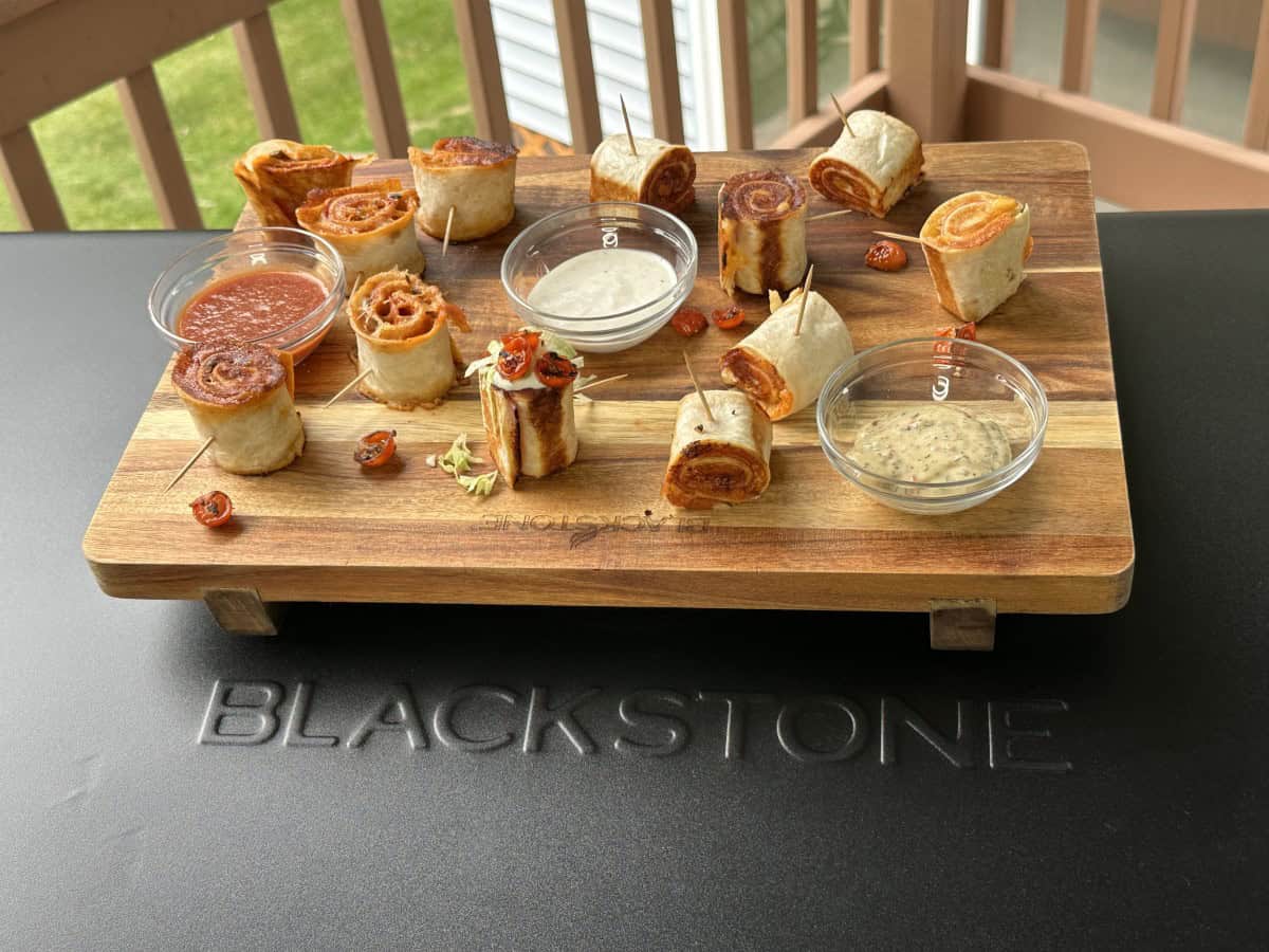 Blackstone Griddle Pinwheel Sandwich Tray displayed on a wooden board