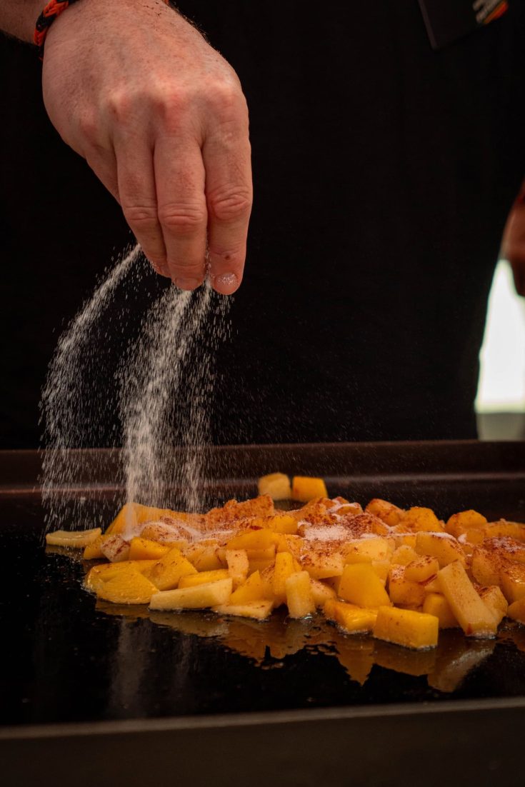 Adding Sugar to Fruit Cooking on a Blackstone Griddle
