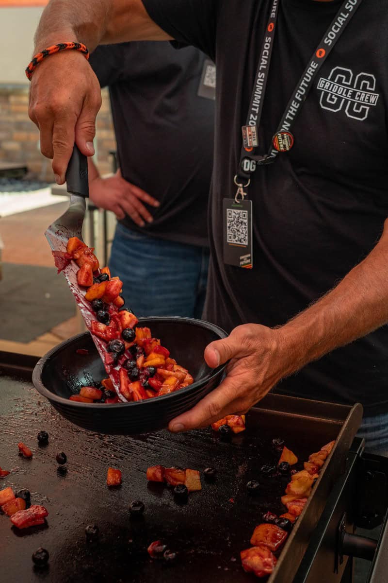 Scooping Cooked Fruit into a Serving Bowl
