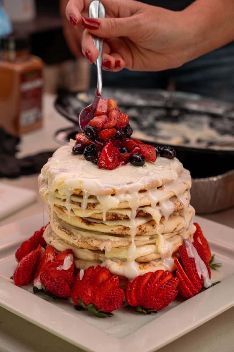 Topping the Smashed Cinnamon Roll Cake with Griddle Fruit