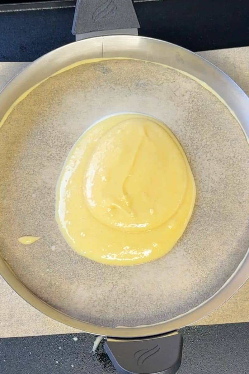 Cake Batter on Parchment Paper with Omelette Ring