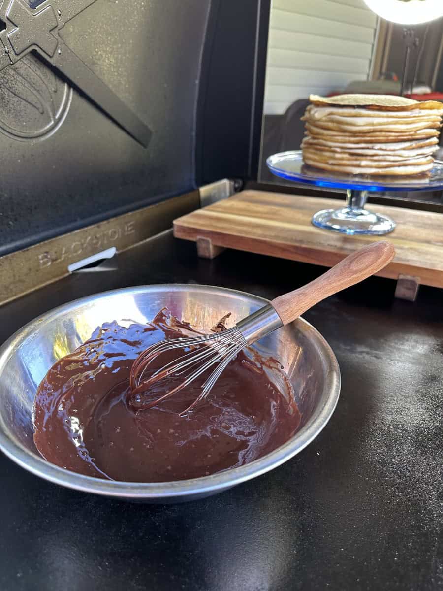 Griddle Ganache Topping in a metal bowl on a Blackstone Griddle.