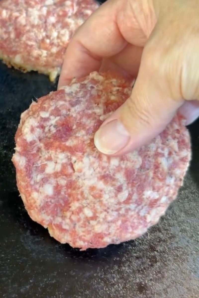 Placing Ground Sausage Patties on a Blackstone Griddle