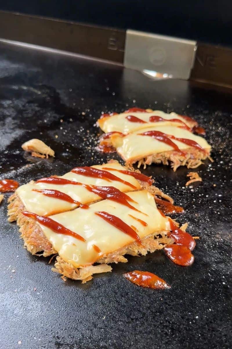 Drizzle BBQ Sauce on top of the Smashed Patties